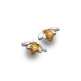 Bee-shaped earrings in gold and silver on a white background